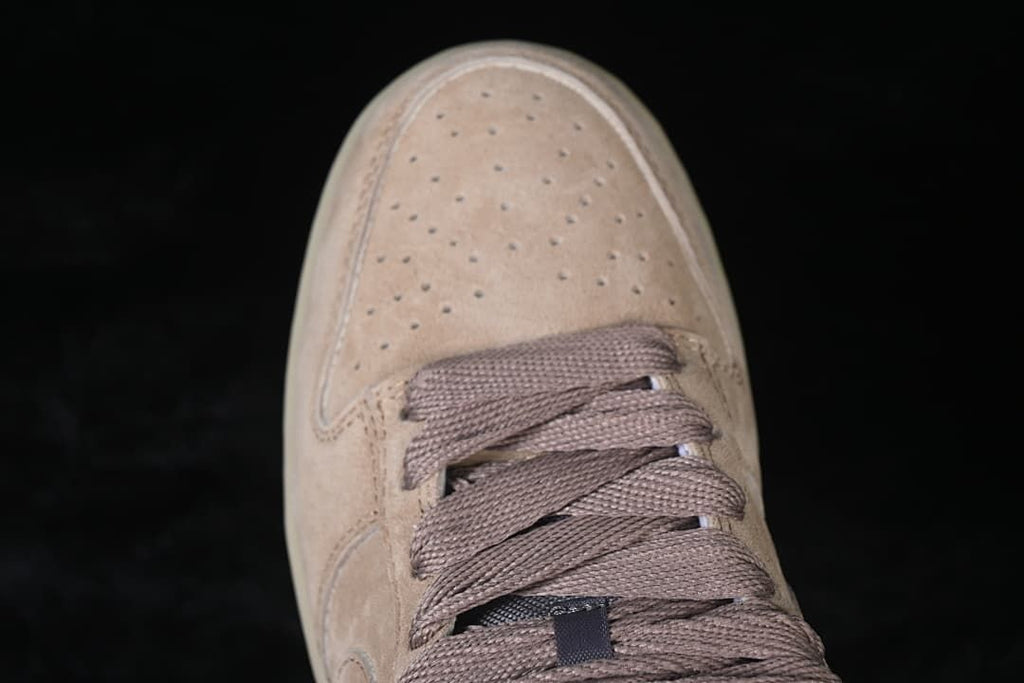 Top view of the perforated toe box and brown laces