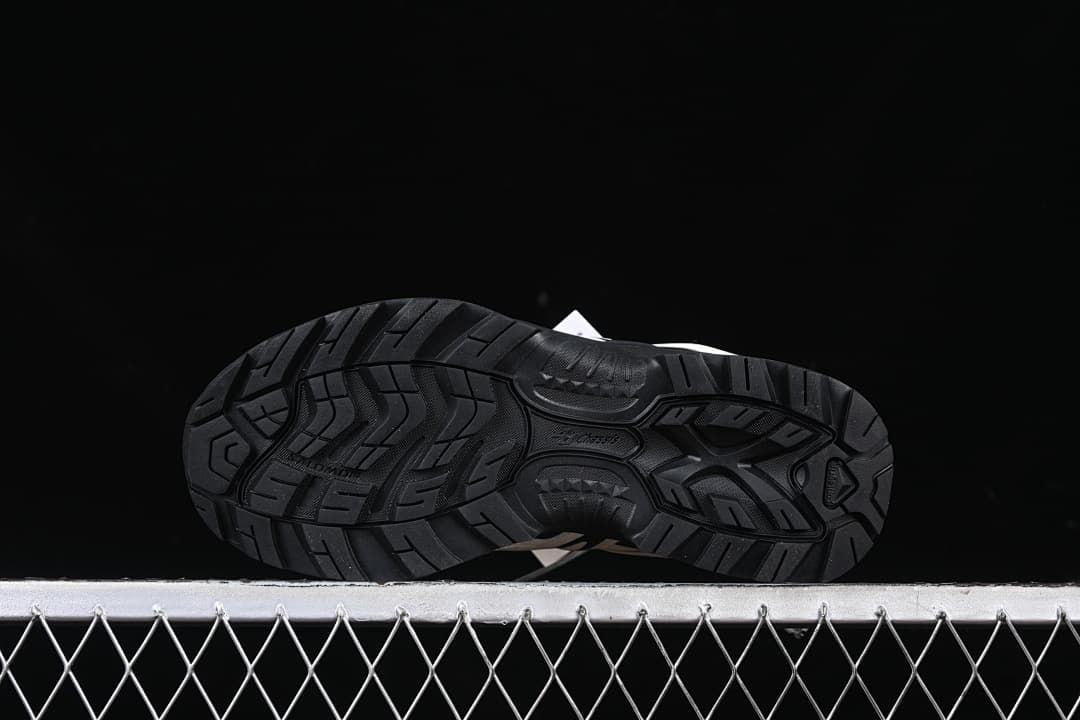 Underside view showing the patterned black outsole.