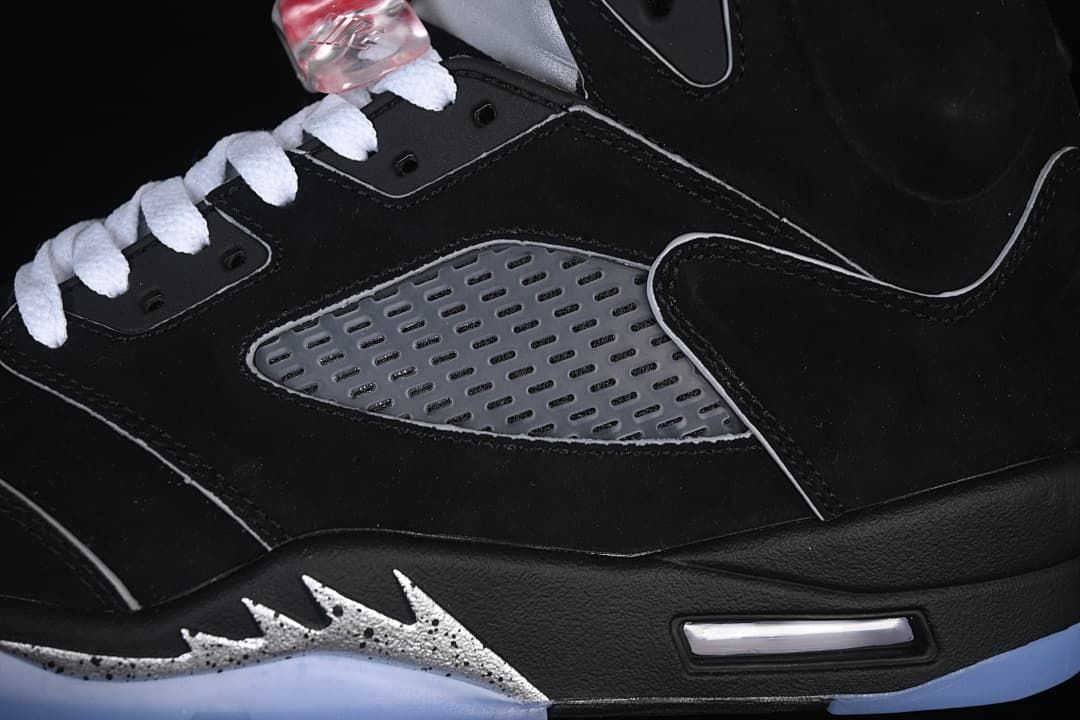 Close-up of the gray side panel, white laces, and visible midsole Air unit