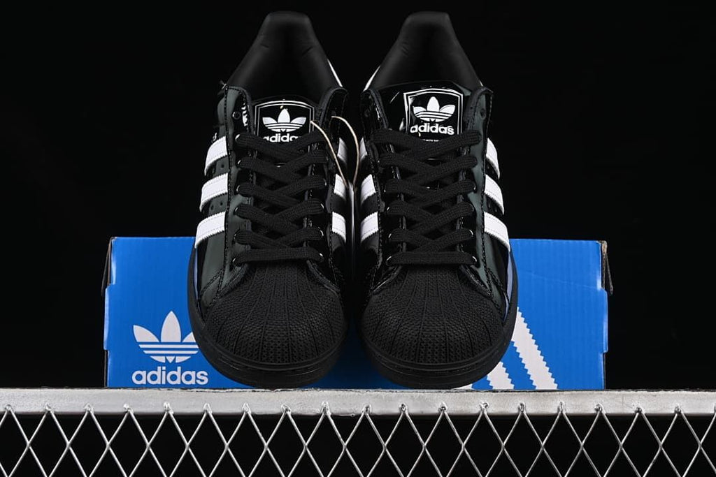 Front view of the pair showing the shell-shaped toe caps and black laces