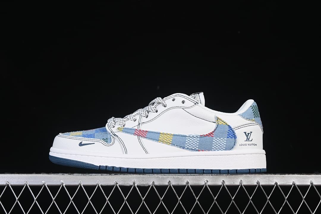 Side view of a white low-top sneaker with blue multicolor patterned panels and a patterned Swoosh.