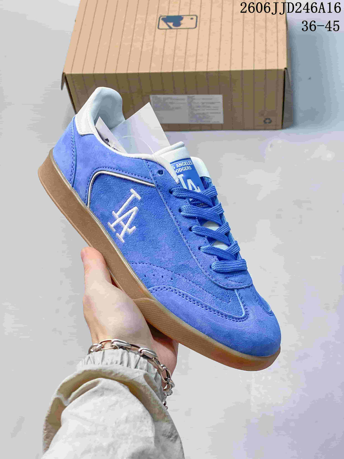 Close-up of a blue Los Angeles Dodgers sneaker with white side graphics and a gum-colored sole.