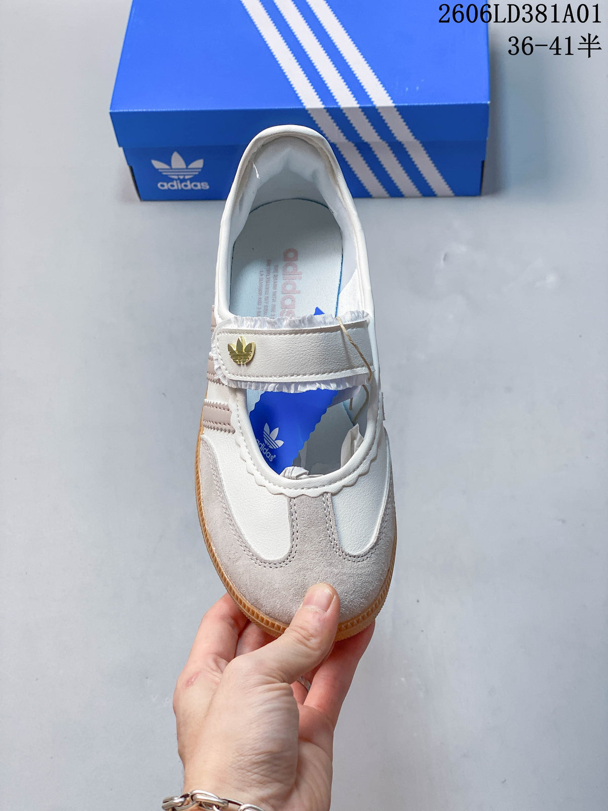 Top view of an Adidas Samba Jane sneaker showing its strap closure and contrast toe panels.