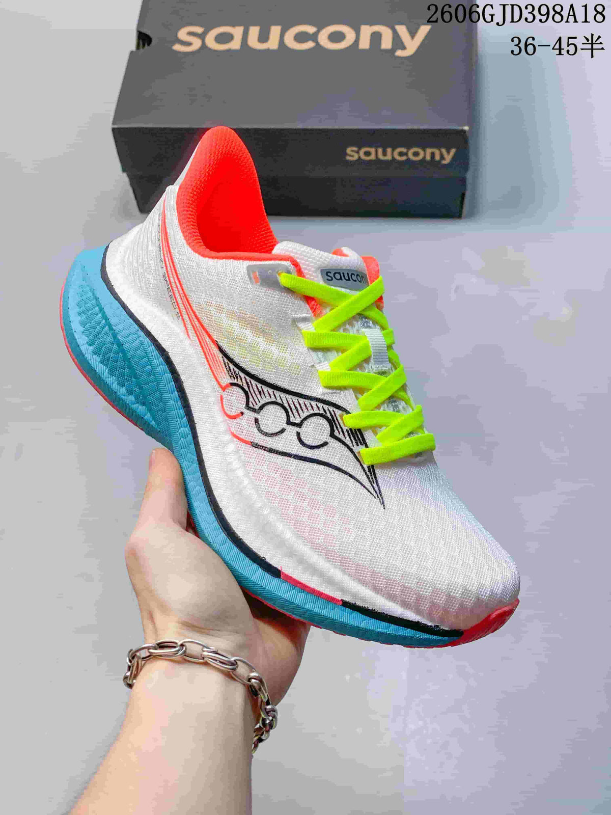 Angled side view of the white Saucony Endorphin Speed 5 running shoe