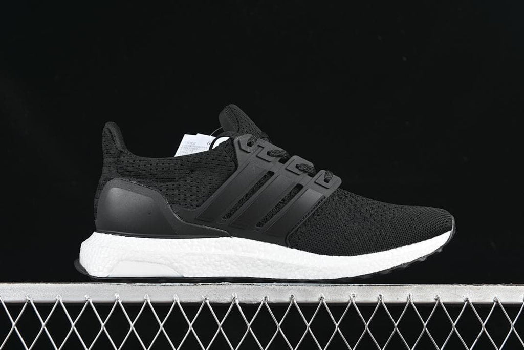 Side profile of a black adidas UltraBoost 1.0 with a white midsole.