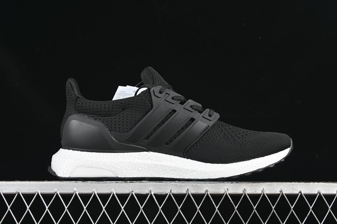 Side profile of a black adidas UltraBoost 1.0 with a white midsole.
