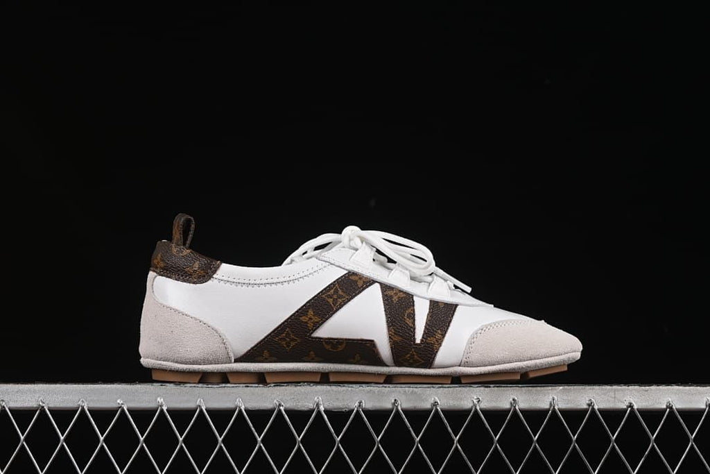 Side profile highlighting the low silhouette, white laces, and patterned side panels.