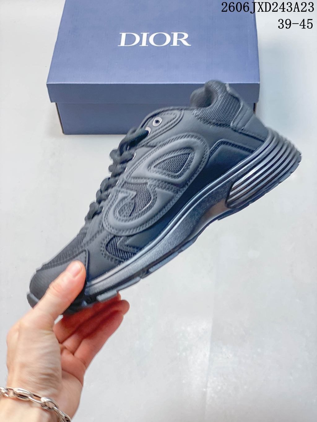 Side profile of a charcoal gray mesh-panel low-top sneaker
