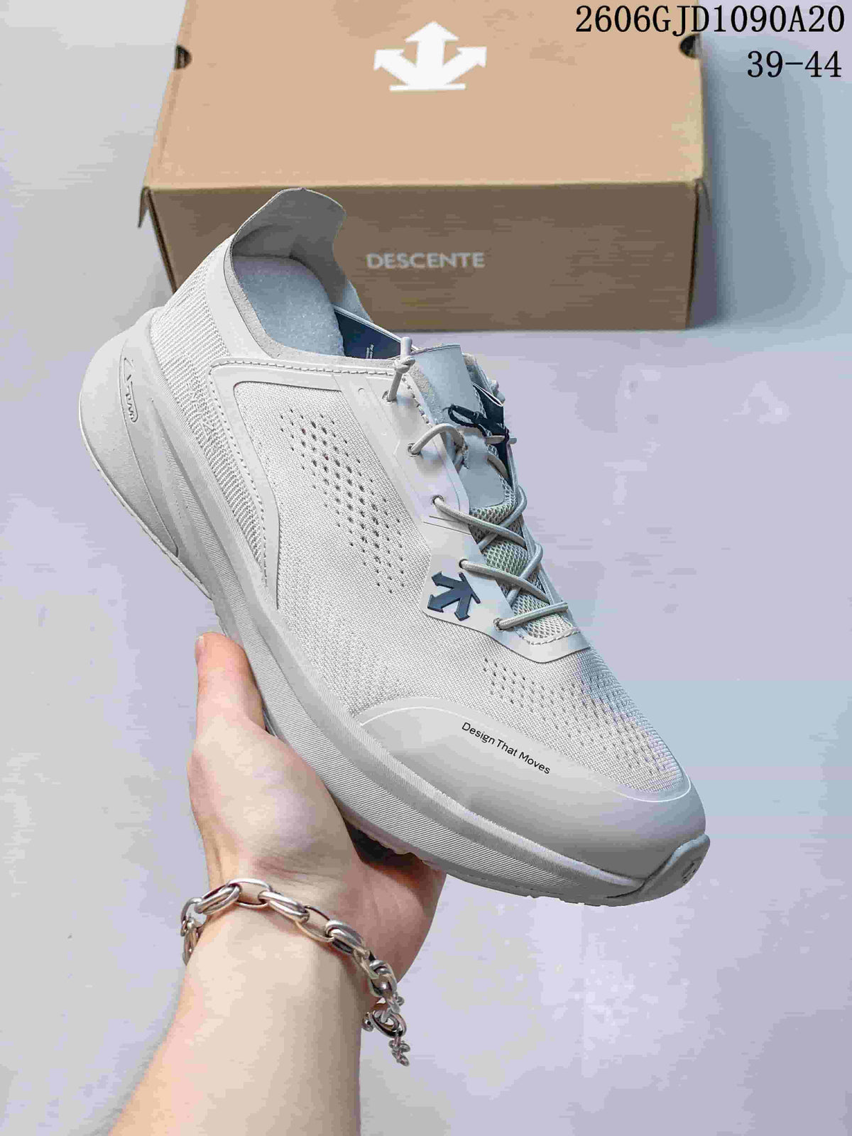 Angled view of the shoe's perforated upper and dial-style lacing