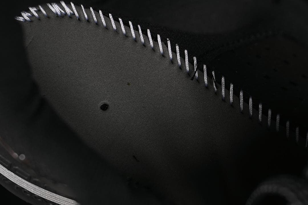 Close-up of the shoe's inner construction and stitching.