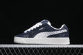 Side view of navy and white Puma Suede XL low-top sneakers