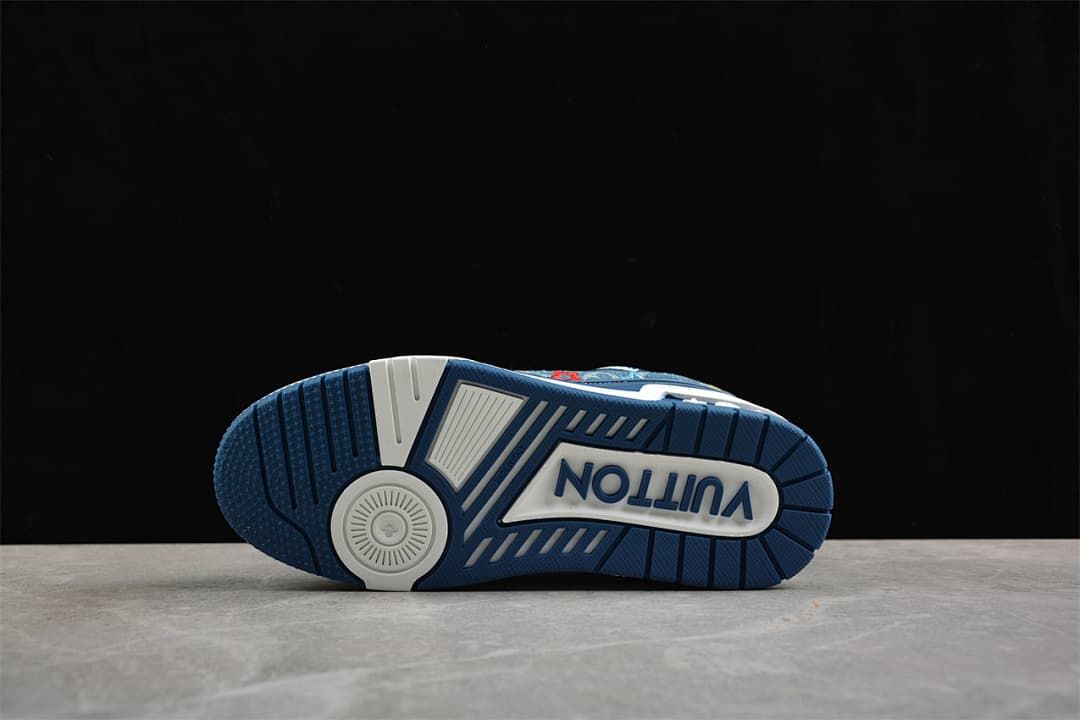 Underside of a sneaker showing a blue-and-white patterned outsole.