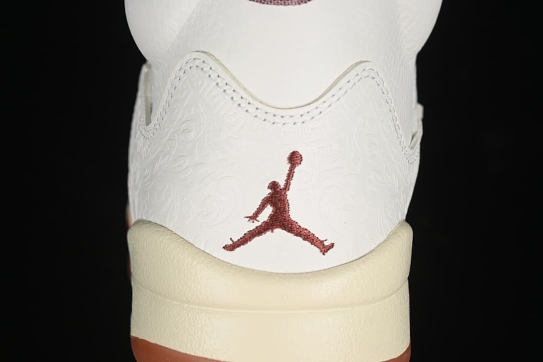 Rear view showing embossed heel details and burgundy Jumpman logo