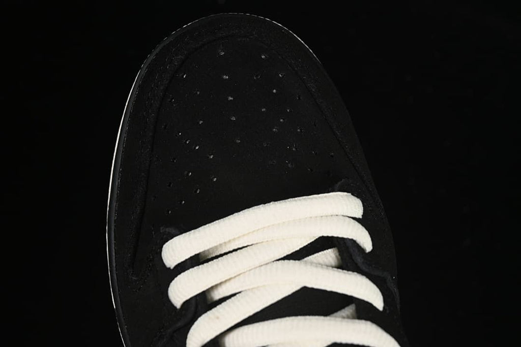 Top view of the perforated black toe and white laces