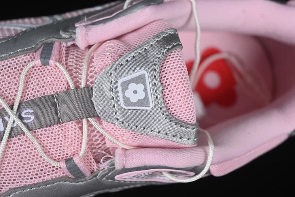 Close-up of the lace area, tongue patch and pink upper