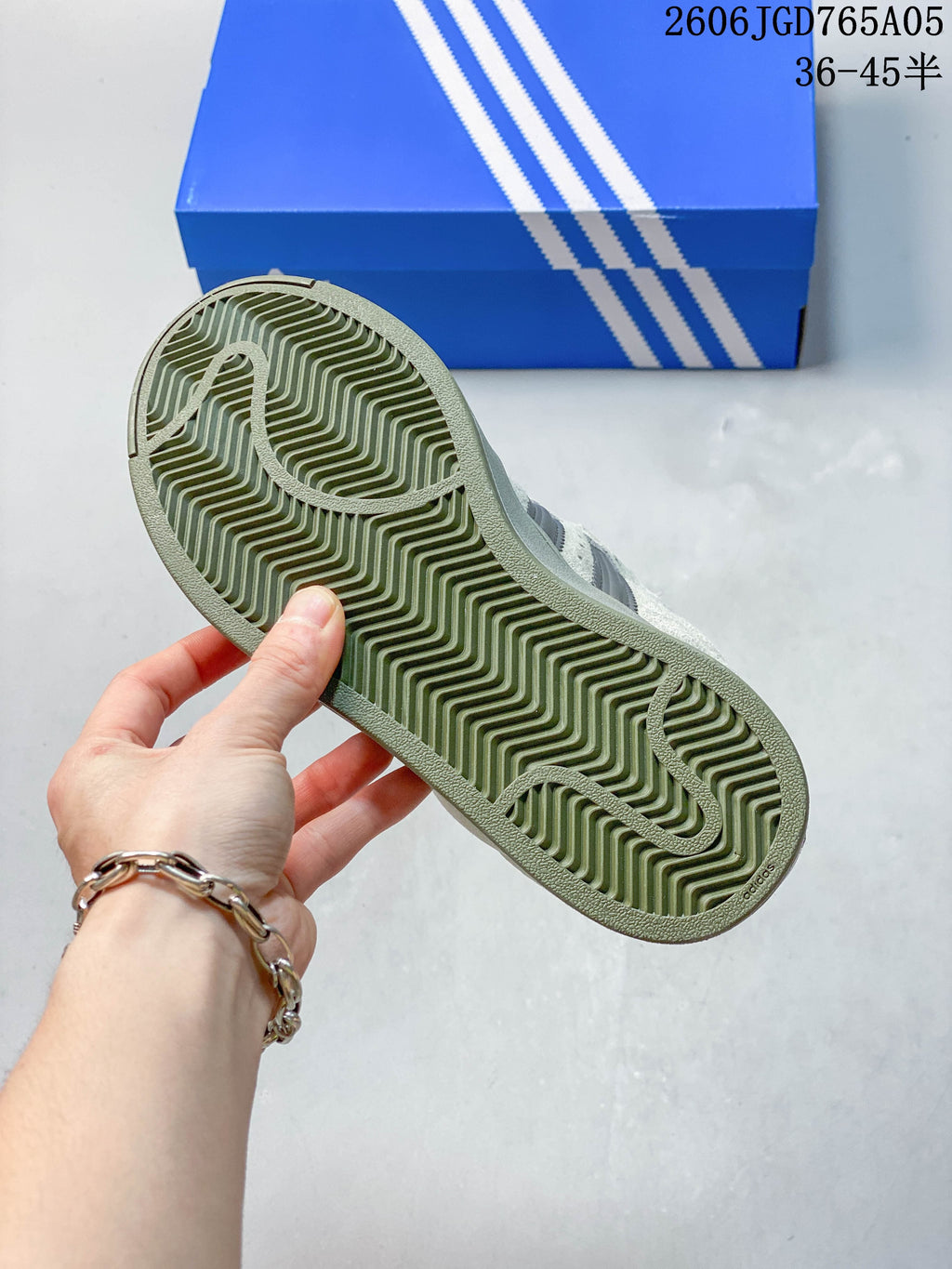 Close-up of the patterned olive outsole on an Adidas Originals Superstar XLG sneaker