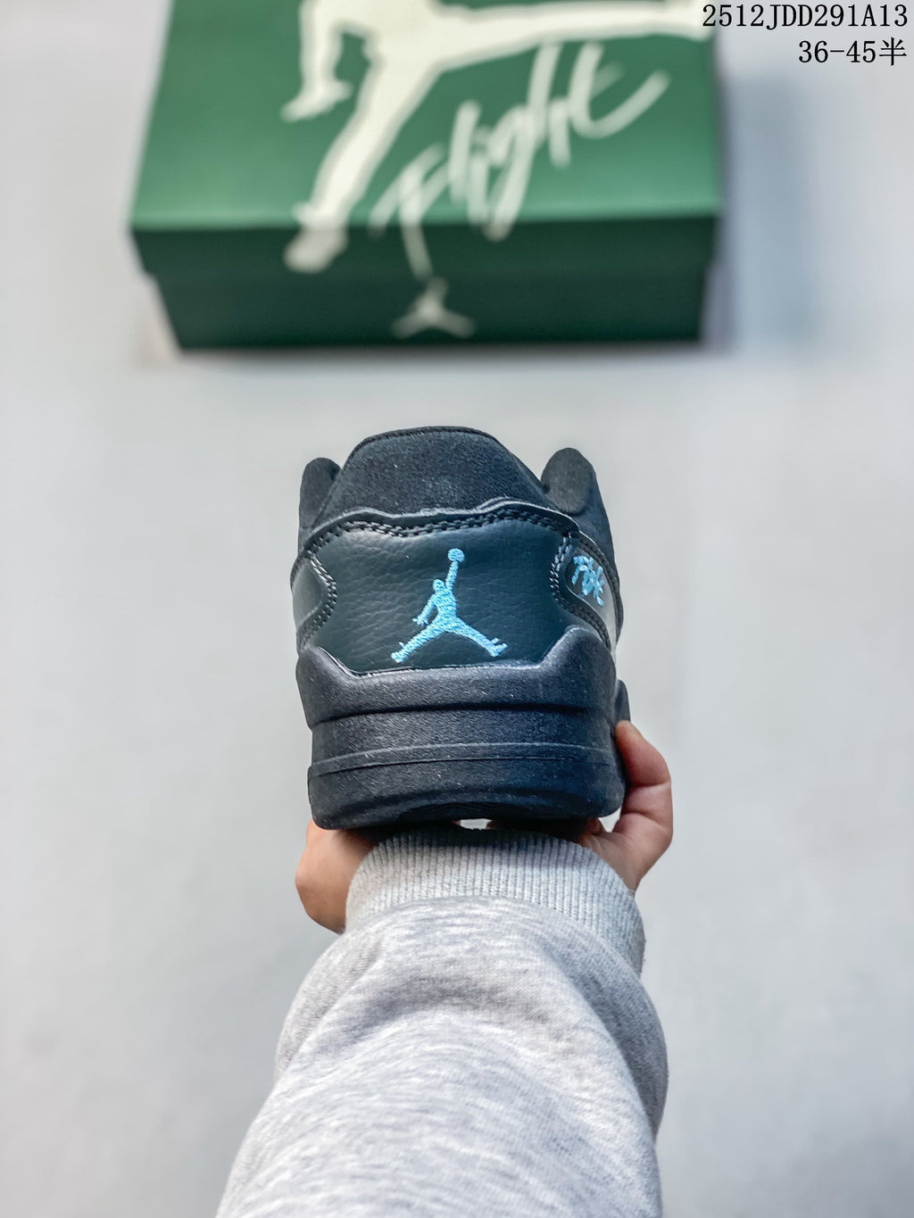 Rear view of the sneaker with a blue Jumpman-style logo detail