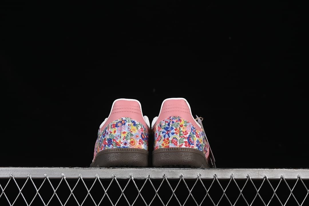 Rear view of the pair showing floral-print heel panels and pink heel tabs