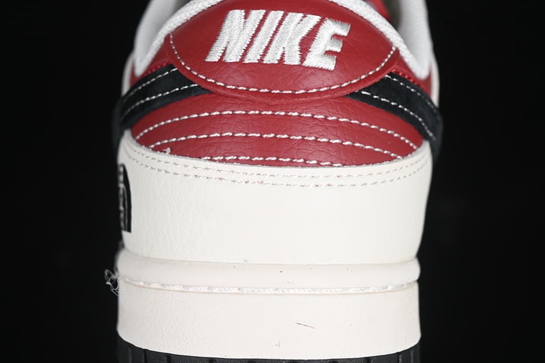Rear view showing red heel panels, black detailing, and Nike branding