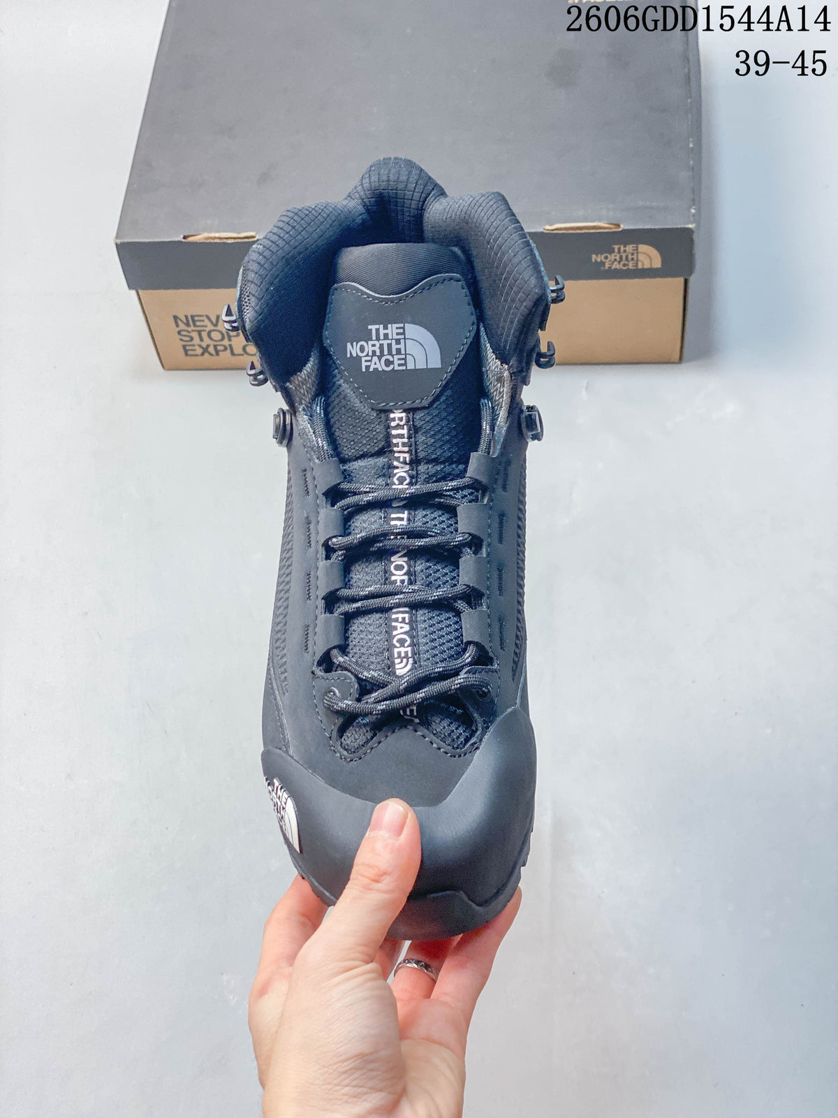 Front view of the boot showing its tongue, laces, and protective toe overlay.