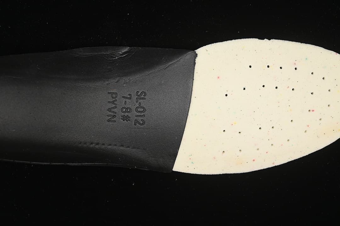 Close-up of the shoe insole underside with printed markings