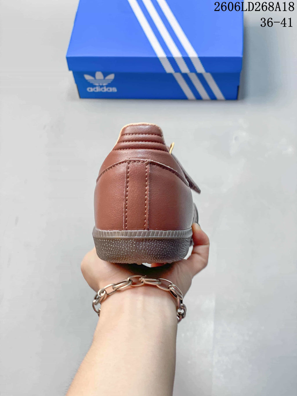Rear view showing the heel and outsole of a brown Samba Jane sneaker