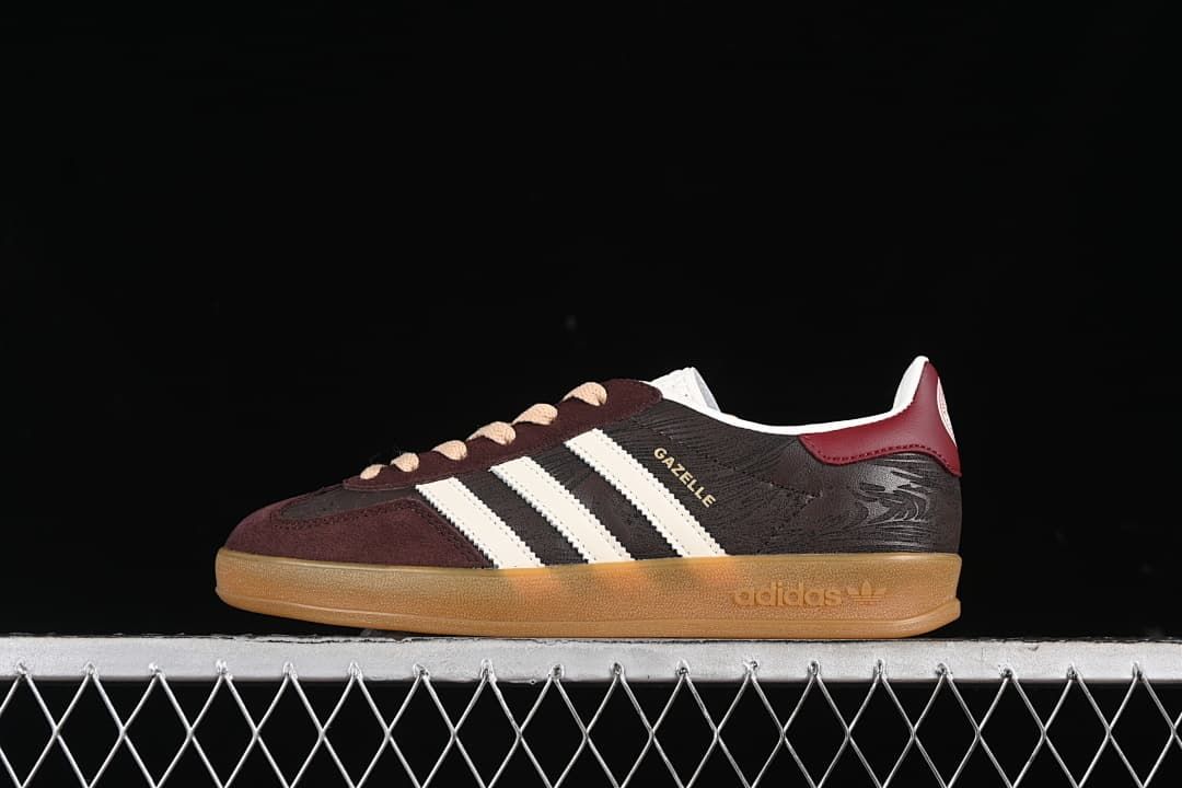 Side view of the Gazelle Indoor sneaker with off-white stripes and gum-colored sole.
