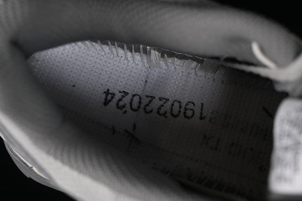 Close-up inside the shoe showing a printed interior marking.