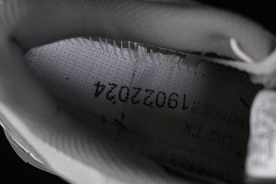 Close-up inside the shoe showing a printed interior marking.