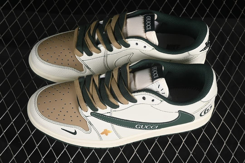 Overhead view of a pair of off-white low-top sneakers with brown toe panels and dark green and brown laces.
