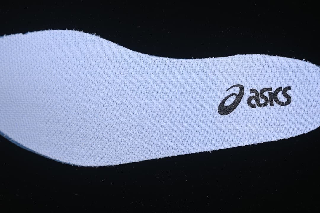 White insole with ASICS logo.