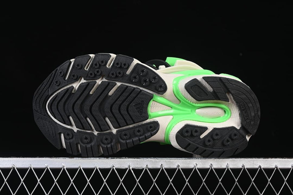 Underside view showing the black rubber outsole tread and bright green detailing.