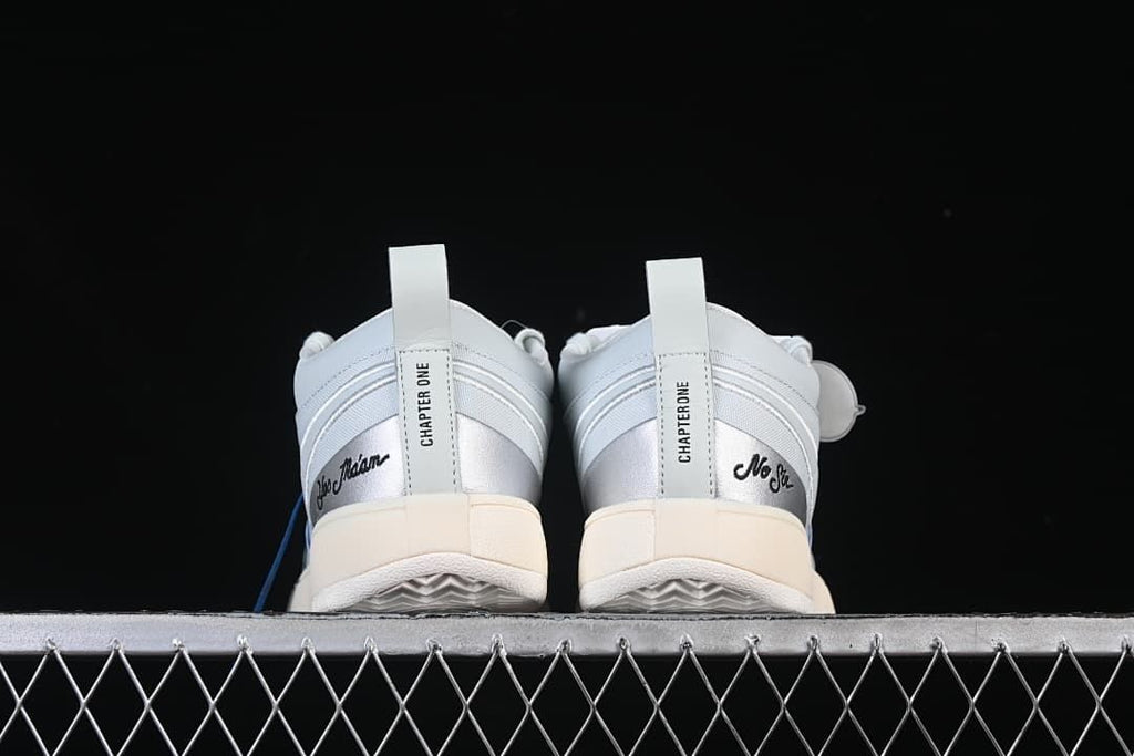 Rear view of both shoes showing metallic heel panels and Chapter One details