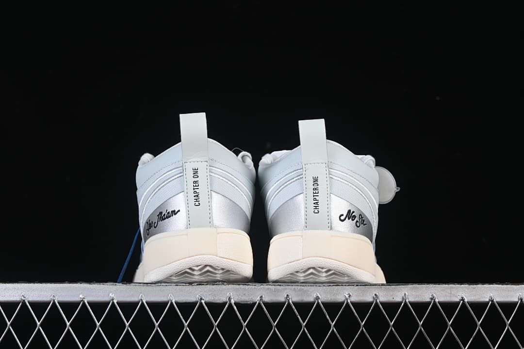Rear view of both shoes showing metallic heel panels and Chapter One details