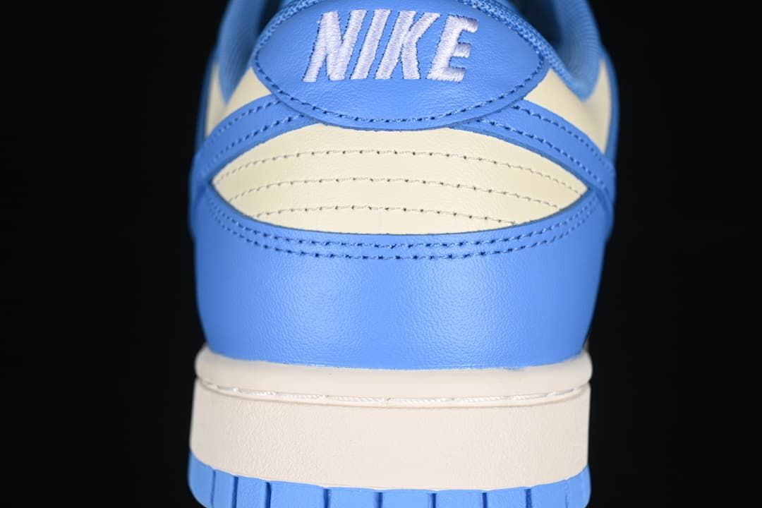 Rear view of the blue and cream sneaker with Nike heel branding