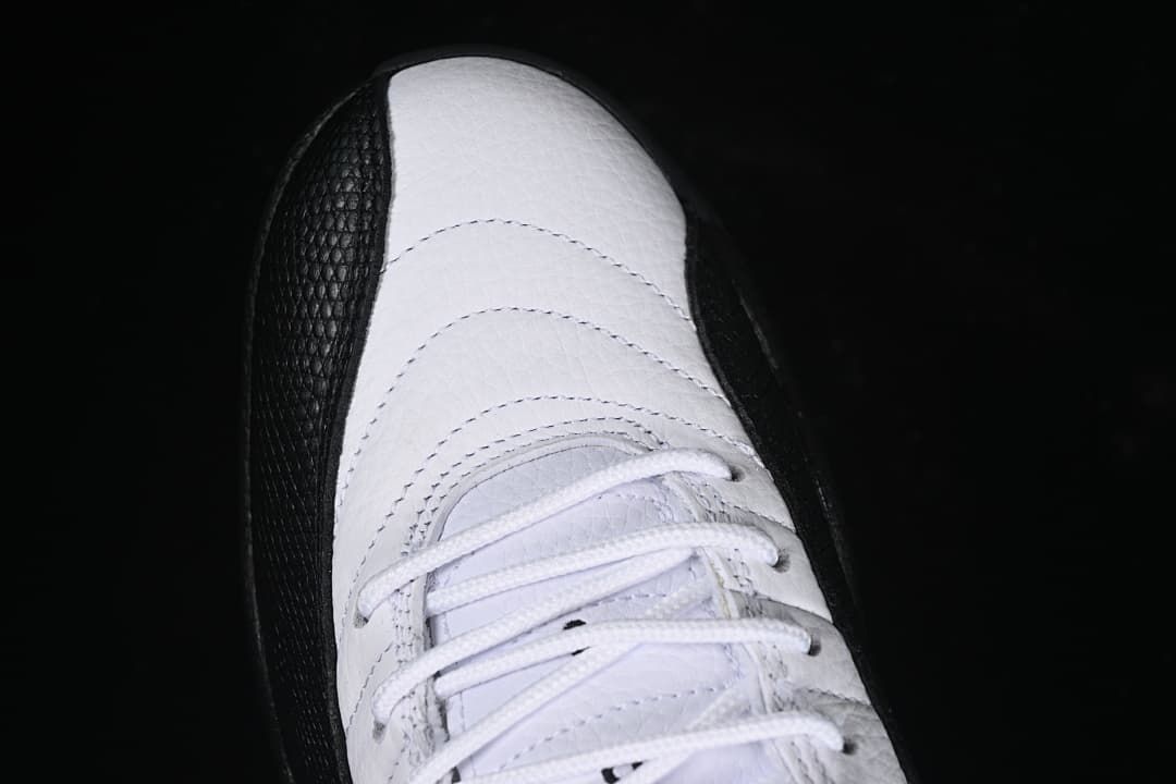 Top view highlighting the white laces and stitched toe area.