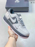 Gray and white low-top Nike Air Force 1 Shadow-style sneaker with layered panels and a dark gray sole.