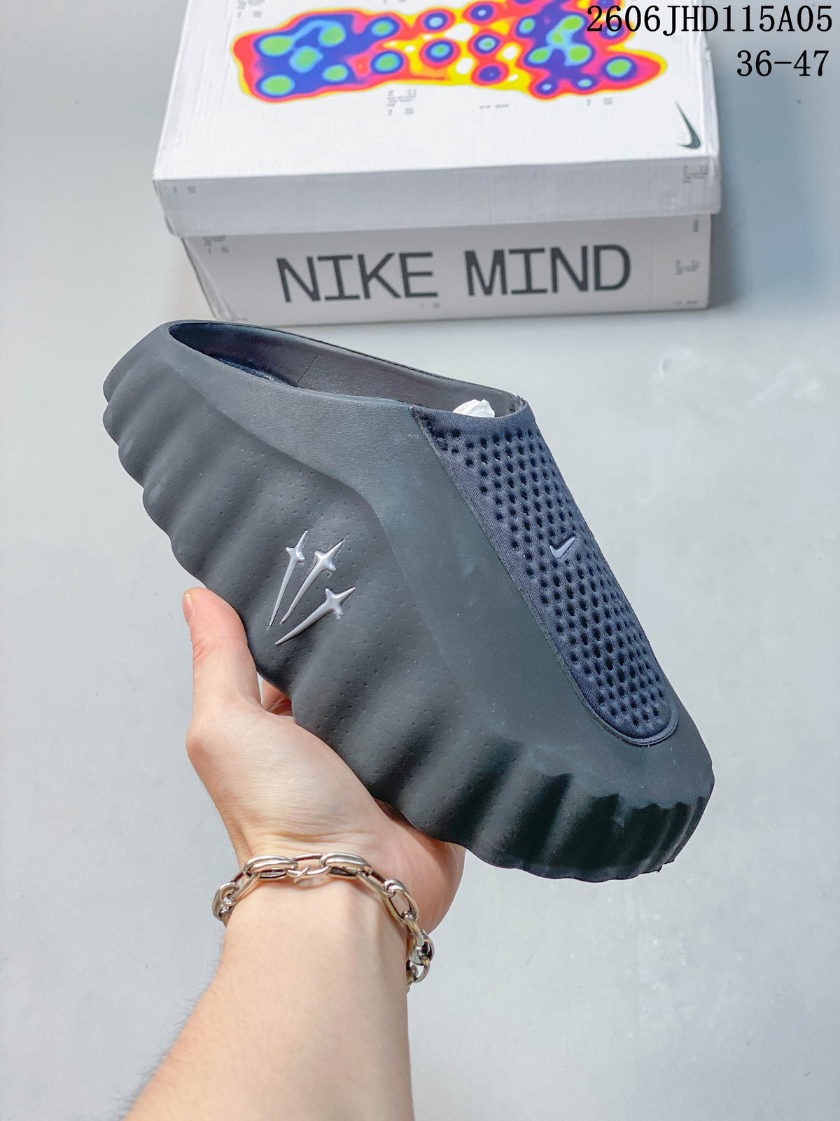 Dark gray Nike Mind slide with a contrasting dark upper panel