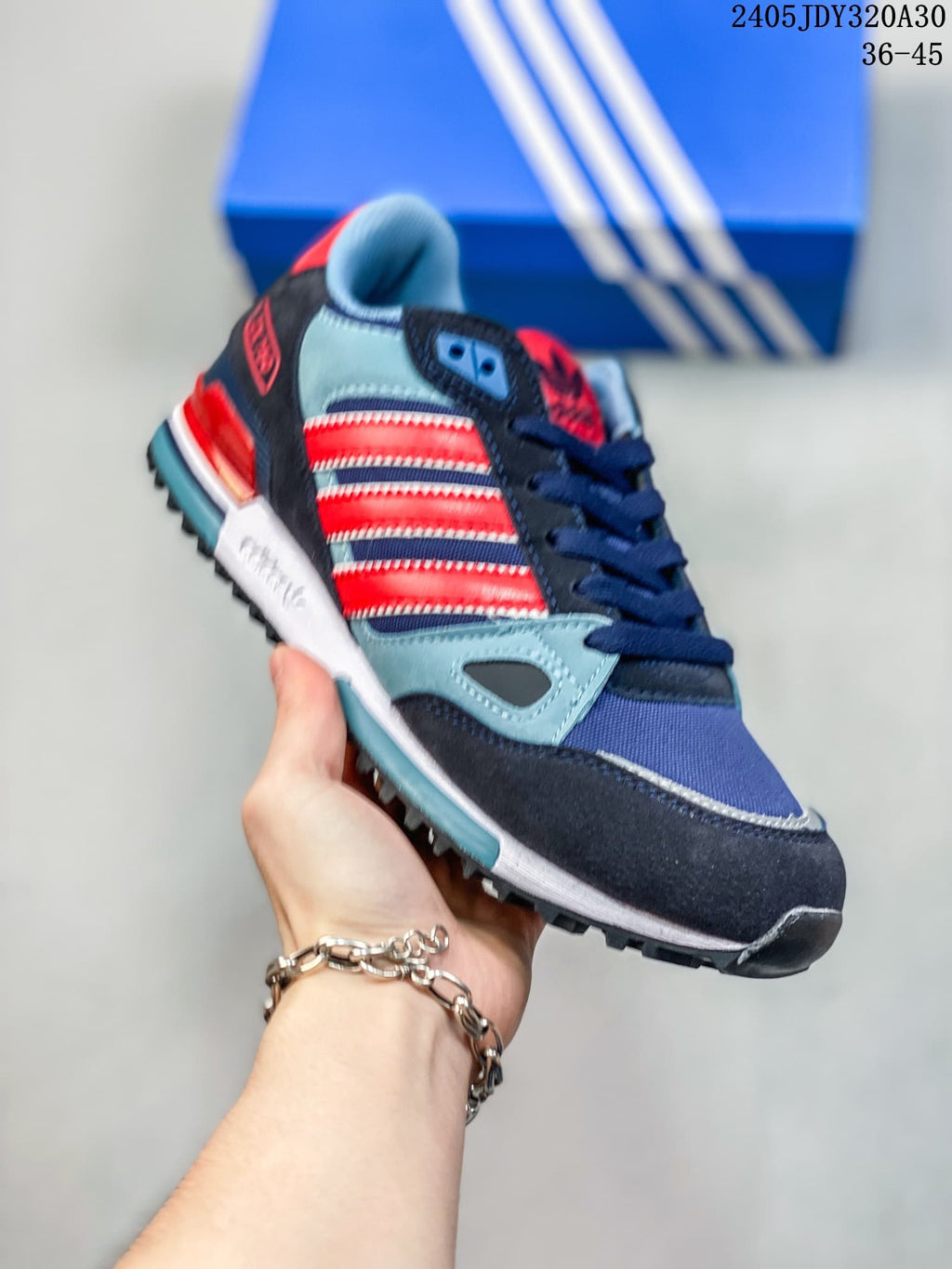 Angled side view of an Adidas Originals ZX 750 sneaker showing its multicolor panels and outsole.