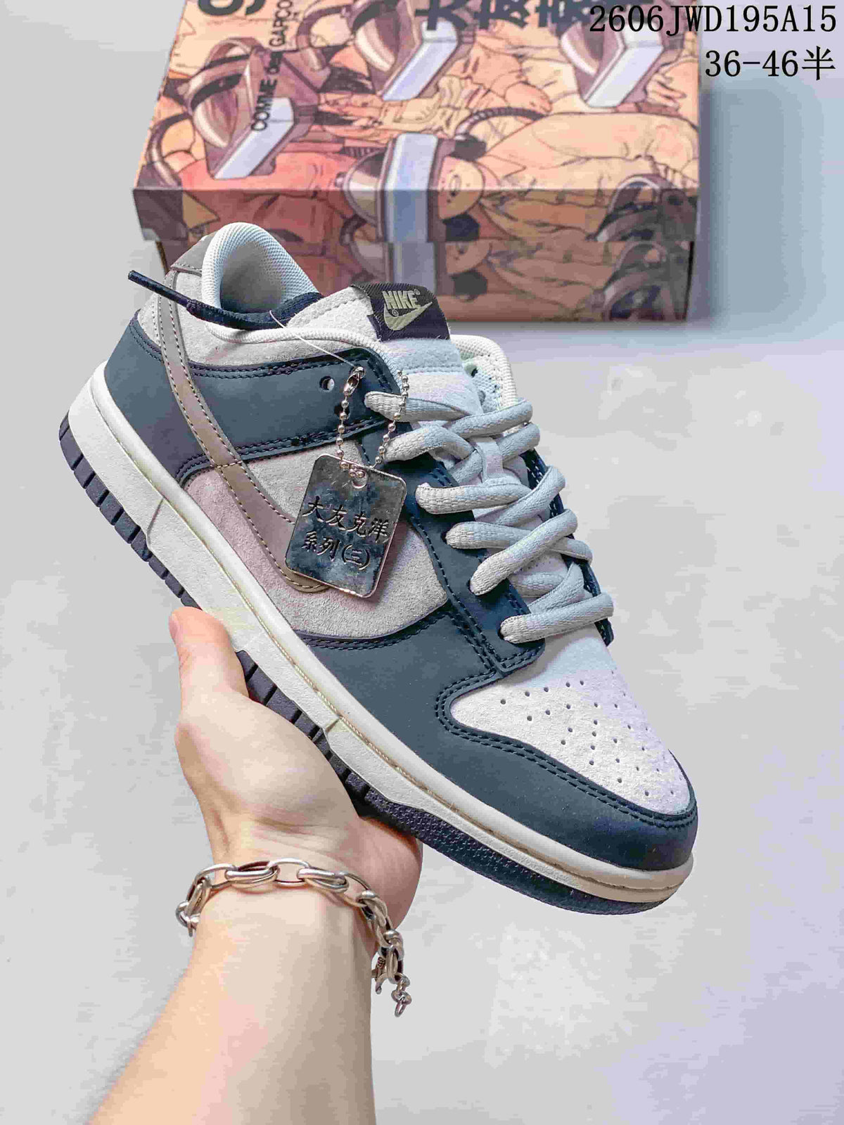 Nike SB Zoom Dunk Low sneaker in light gray and pink with a contrasting dark outsole.
