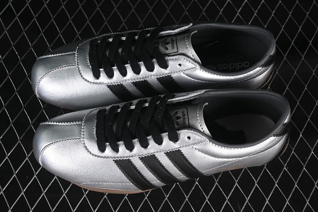 Pair of silver adidas Tokyo sneakers viewed from above