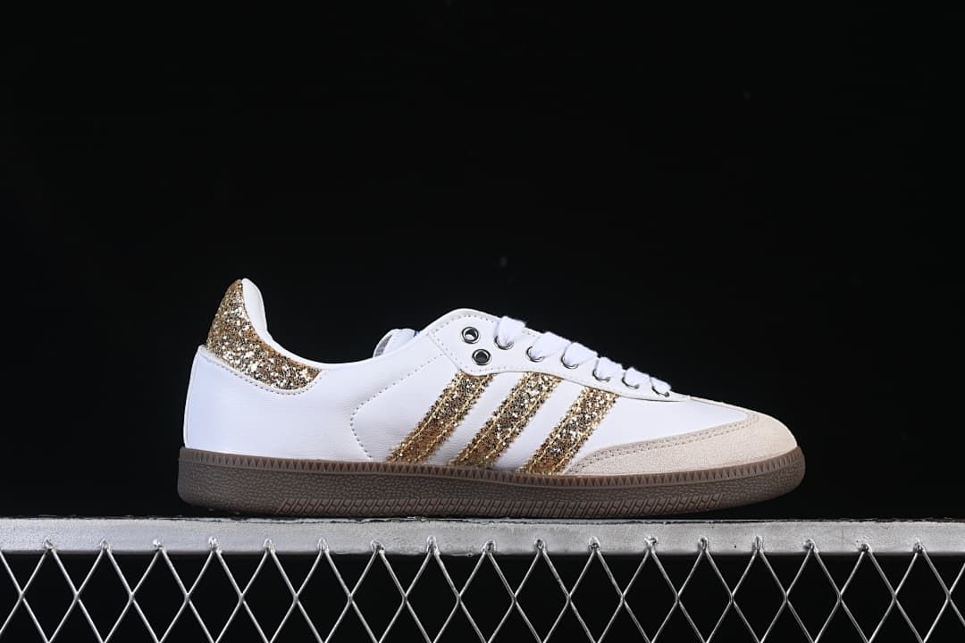 Side profile of the sneaker with gold glitter-style stripes and heel accent