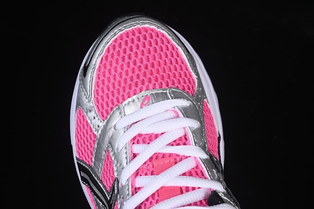 Top view of the pink mesh-style toe and white laces.