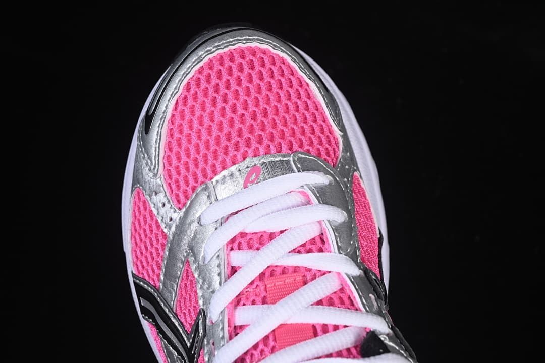 Top view of the pink mesh-style toe and white laces.