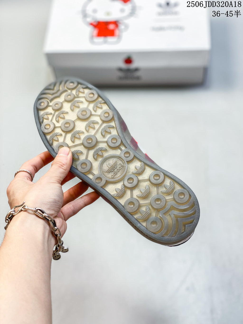 Close-up of the patterned outsole on the white and red sneakers