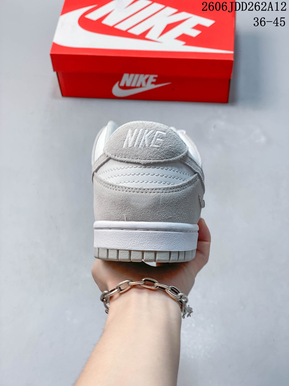 Rear view showing the grey heel panel and white midsole.