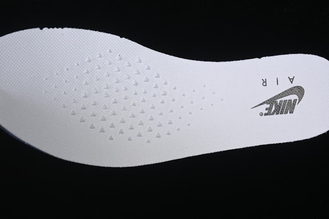 White insole with printed Nike branding and textured detail