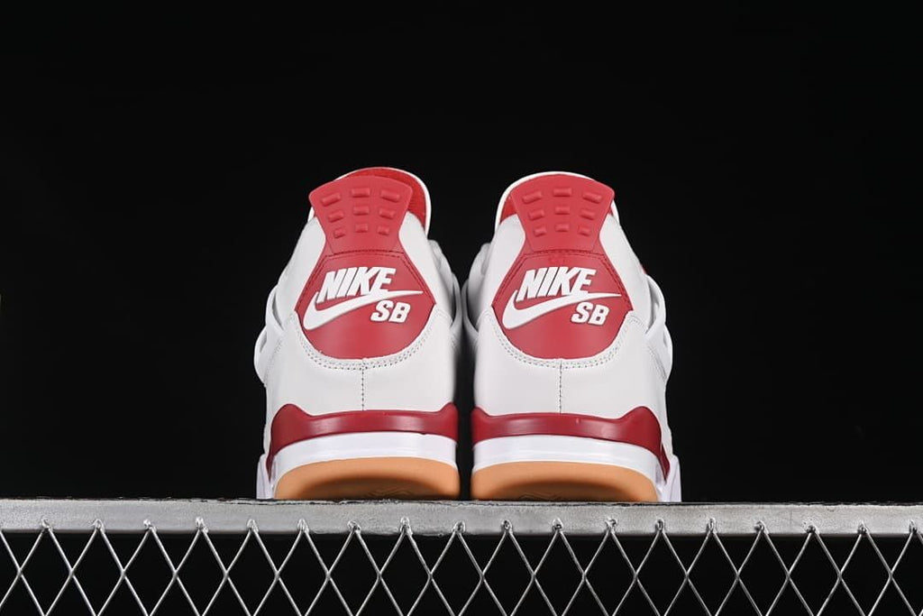 Rear view of both sneakers with red heel panels
