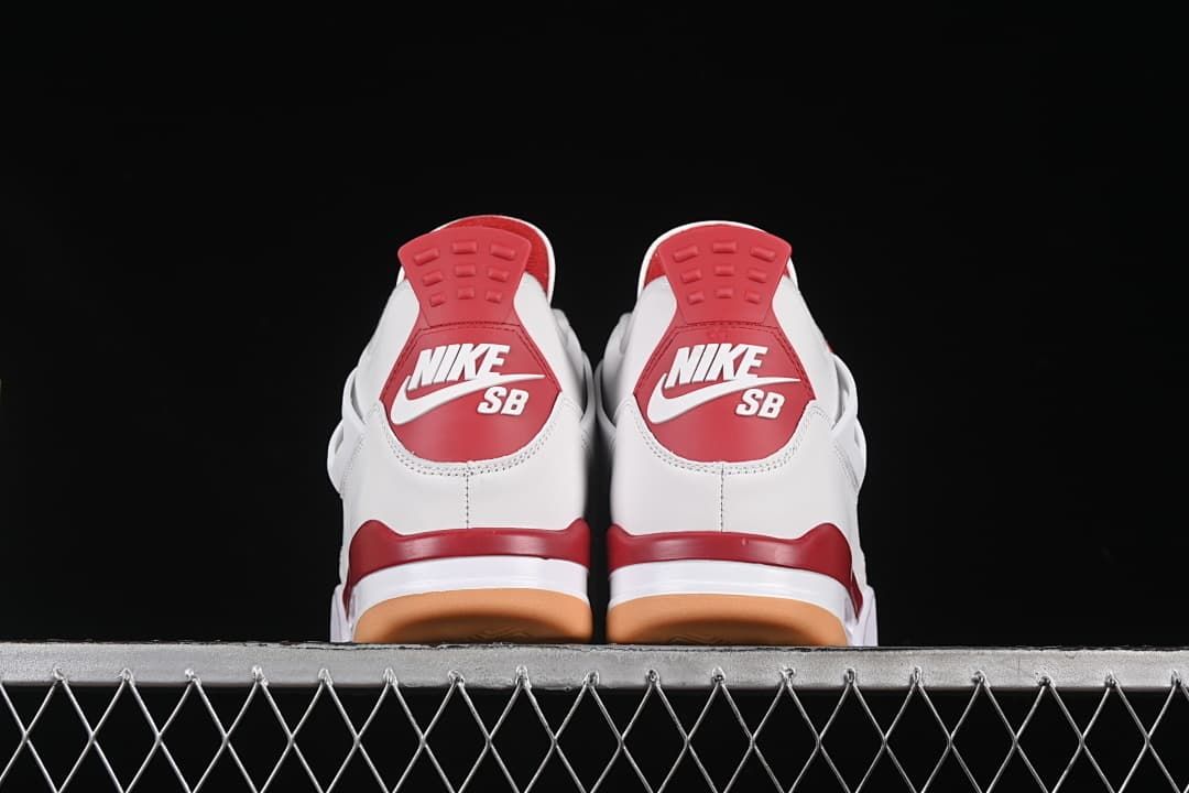 Rear view of both sneakers with red heel panels