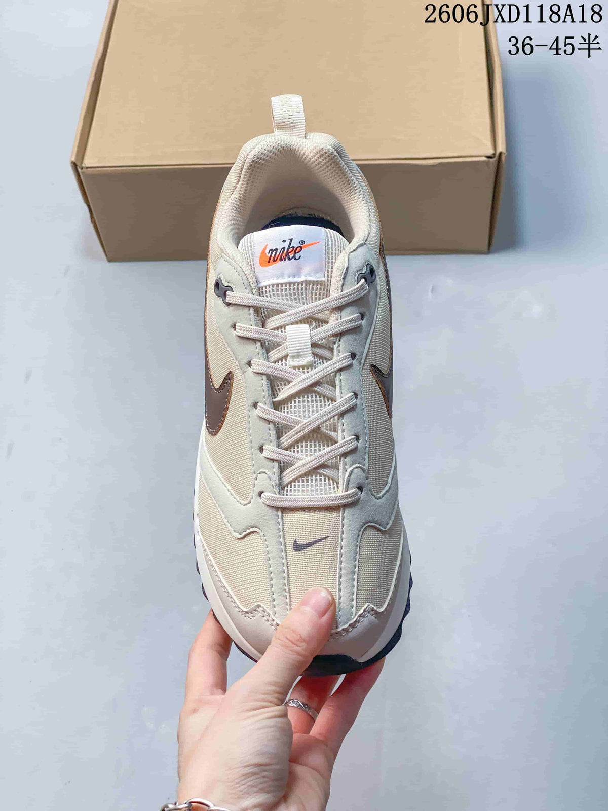 Top view of a Nike Air Max Dawn sneaker showing the laces and layered upper